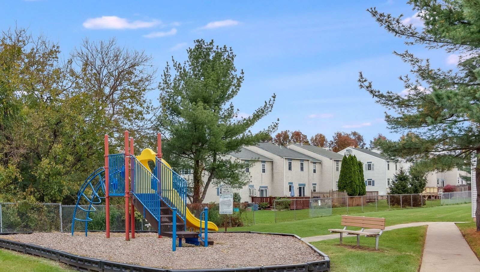 Rolling Hills Apartments in Pottstown, Pennsylvania, with townhomes, green space and a playground