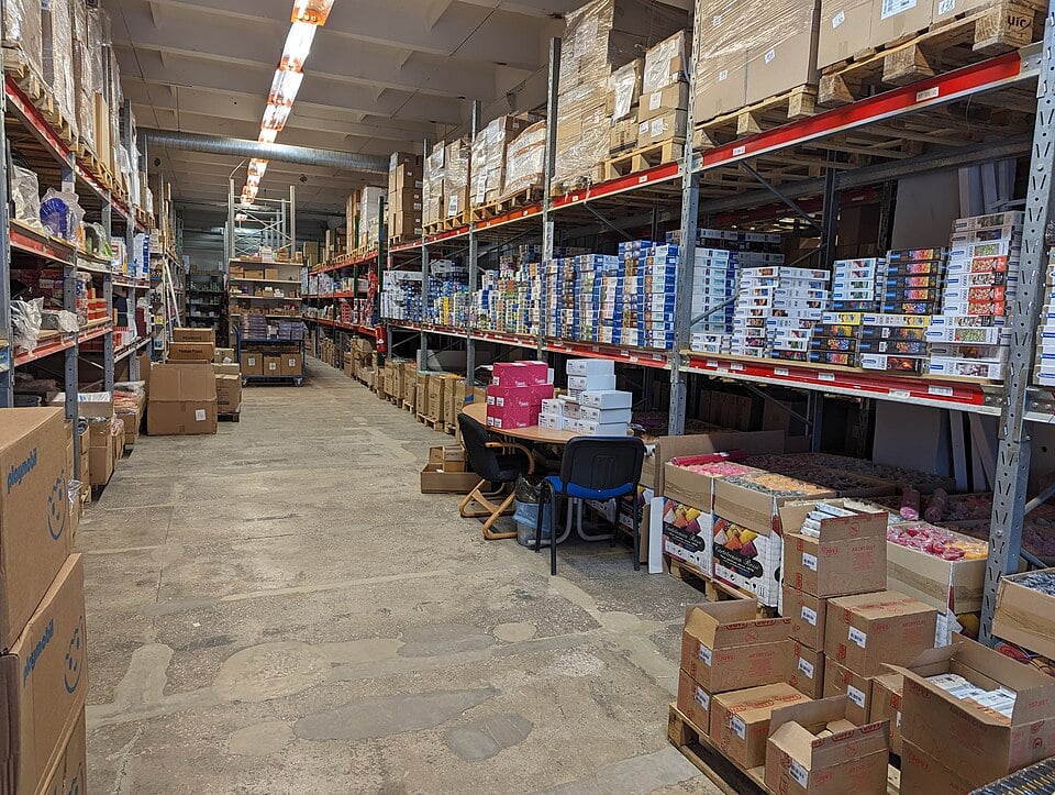 Warehouse aisles and storage racks in a real working warehouse in Riga